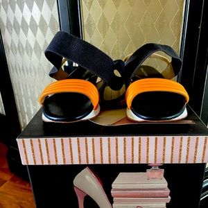 Donald Pliner, wrap around ankle sandal. 9. Navy blue, Gold, and White.